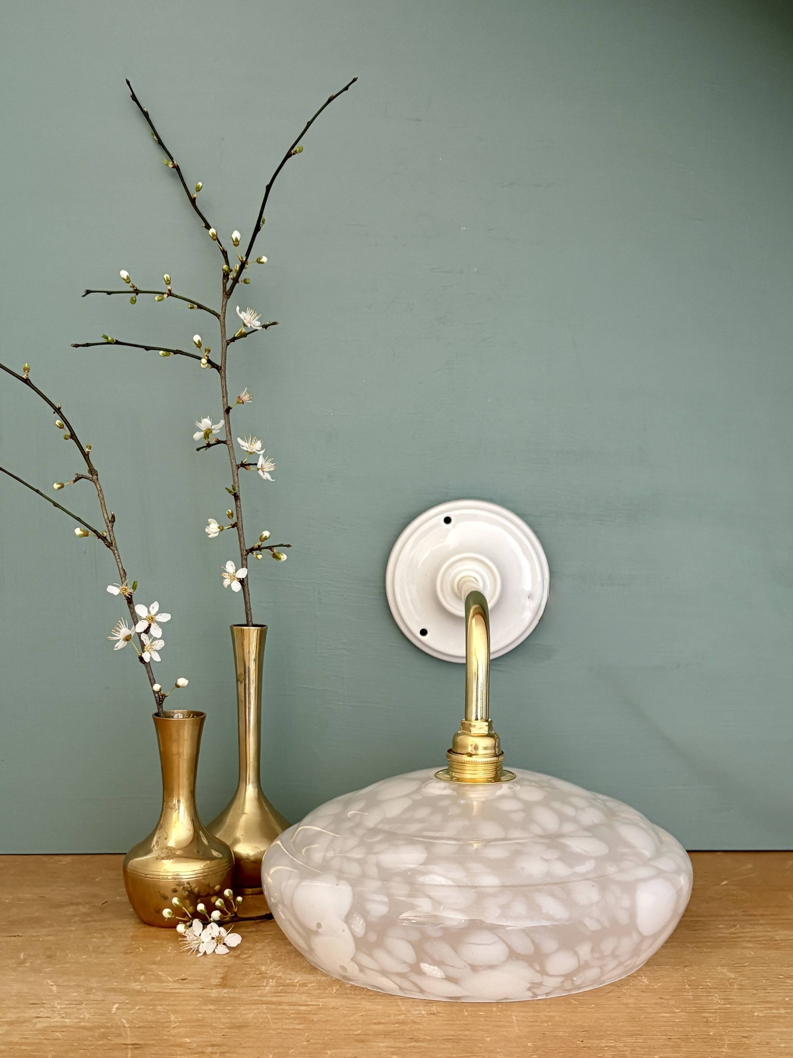 Vintage glass wall lamp with a white Clichy shade.