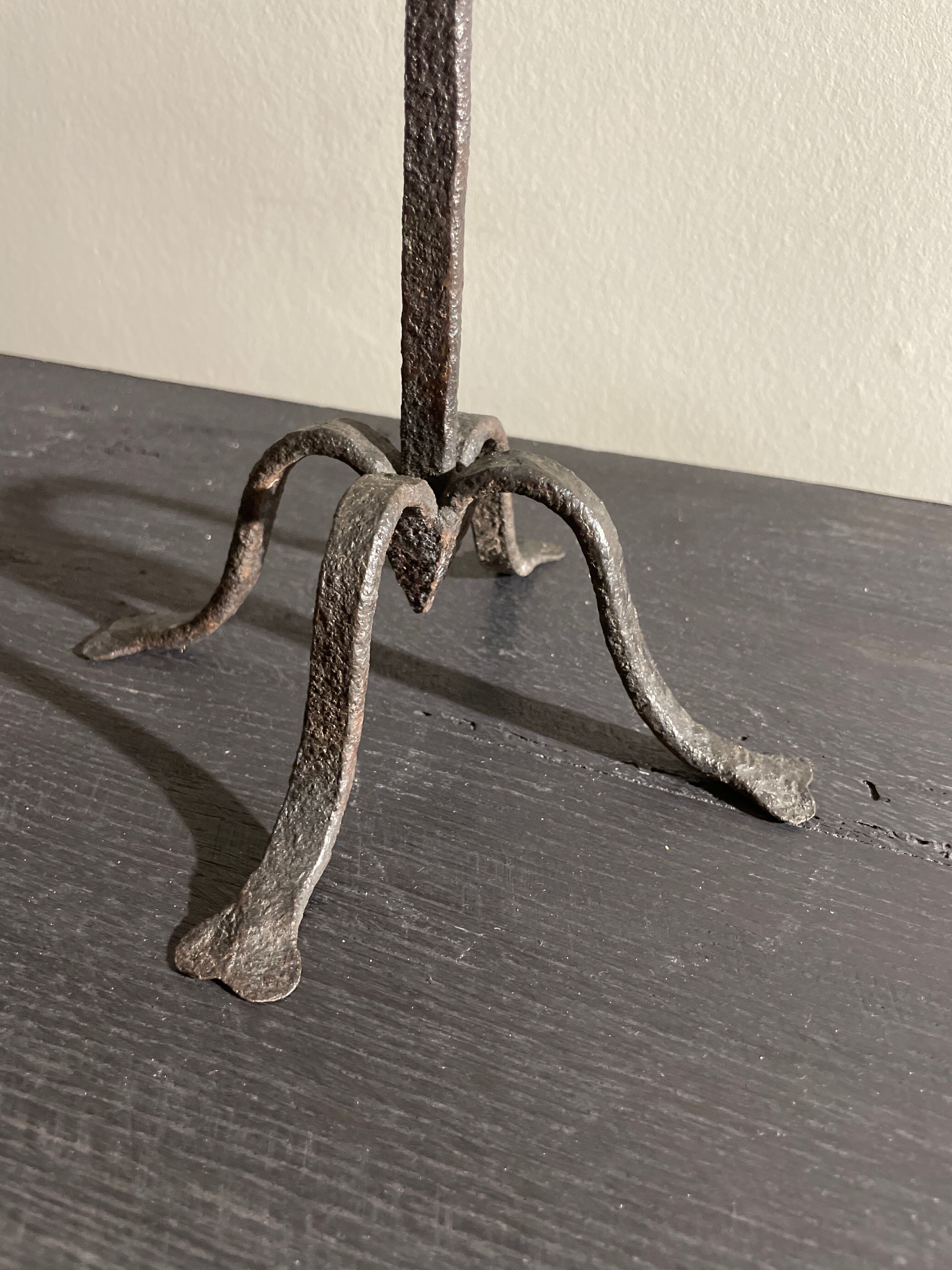Pair of beaten iron candlesticks