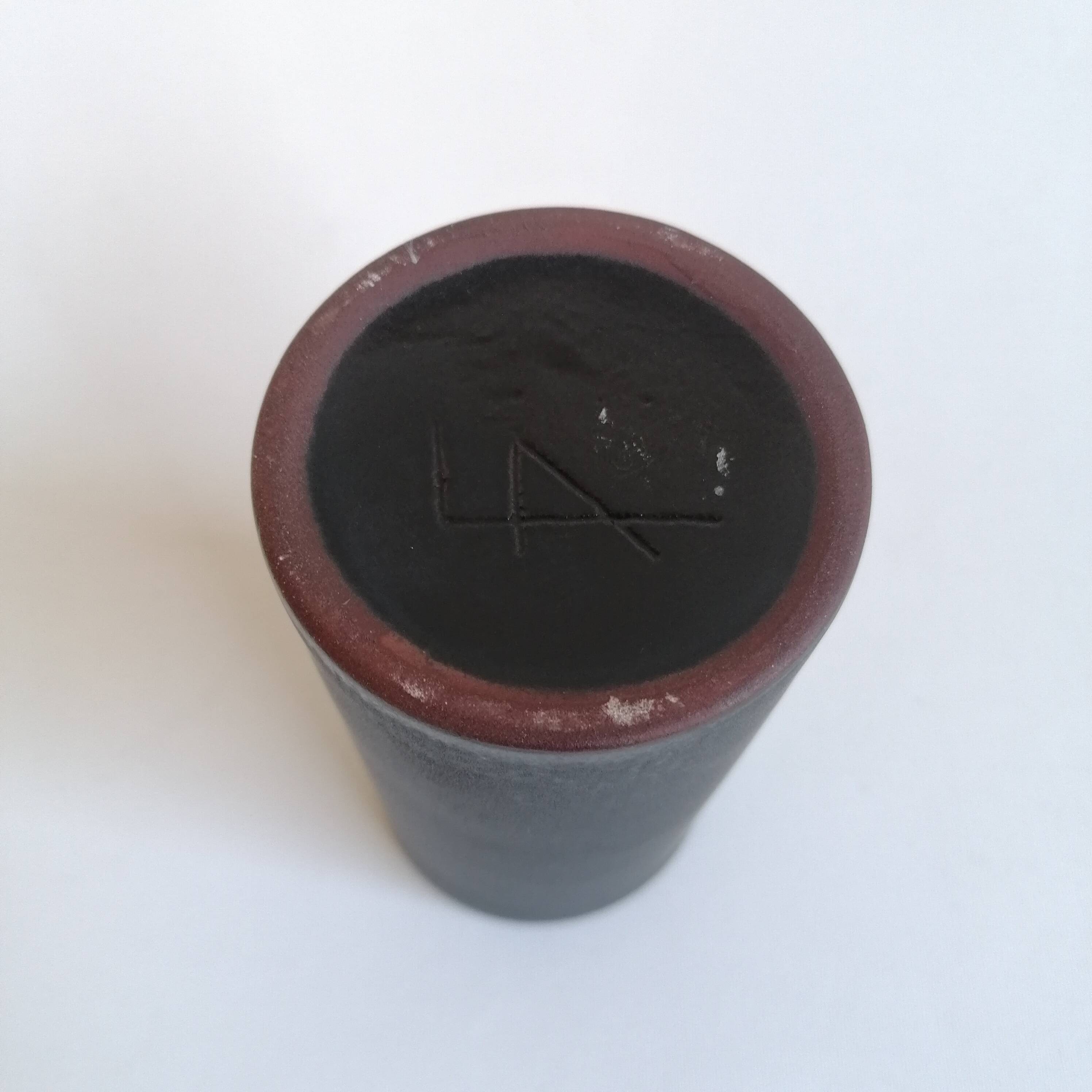 Matte black scroll vase by Antonio Lampecco
