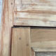 Large antique wardrobe made of wood and burlap.