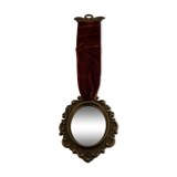 Vintage oval wall-mounted brass mirror