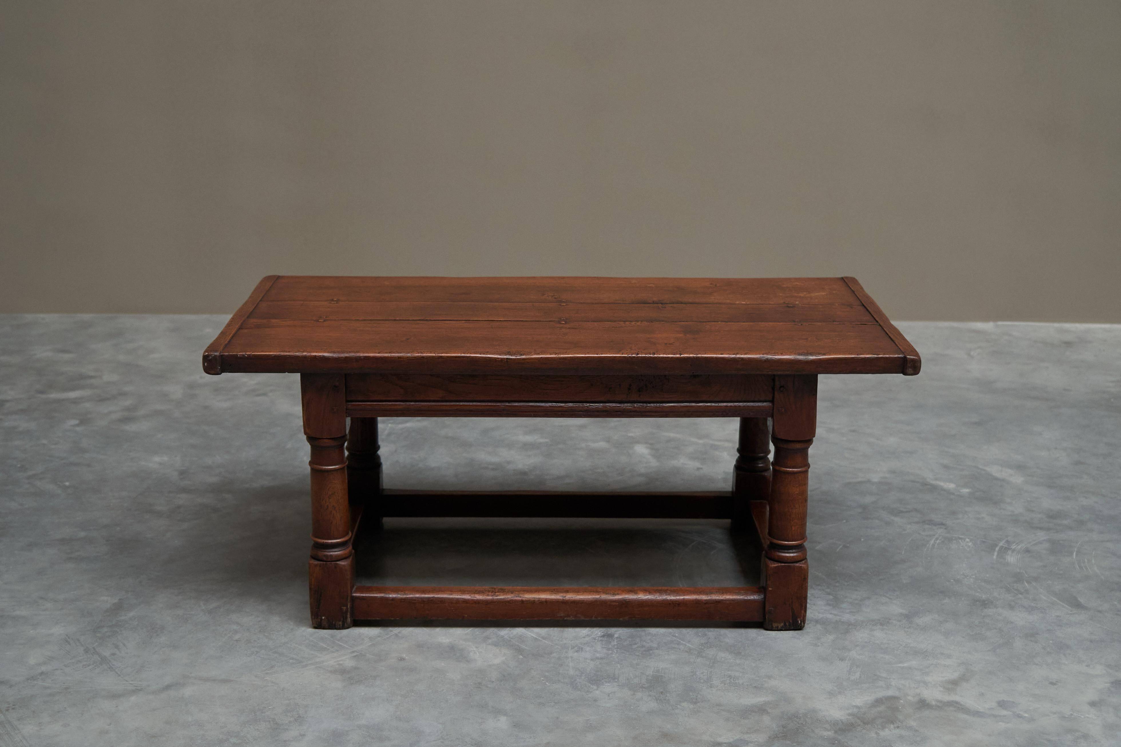 Antique solid oak coffee table in refectory style, 19th century.