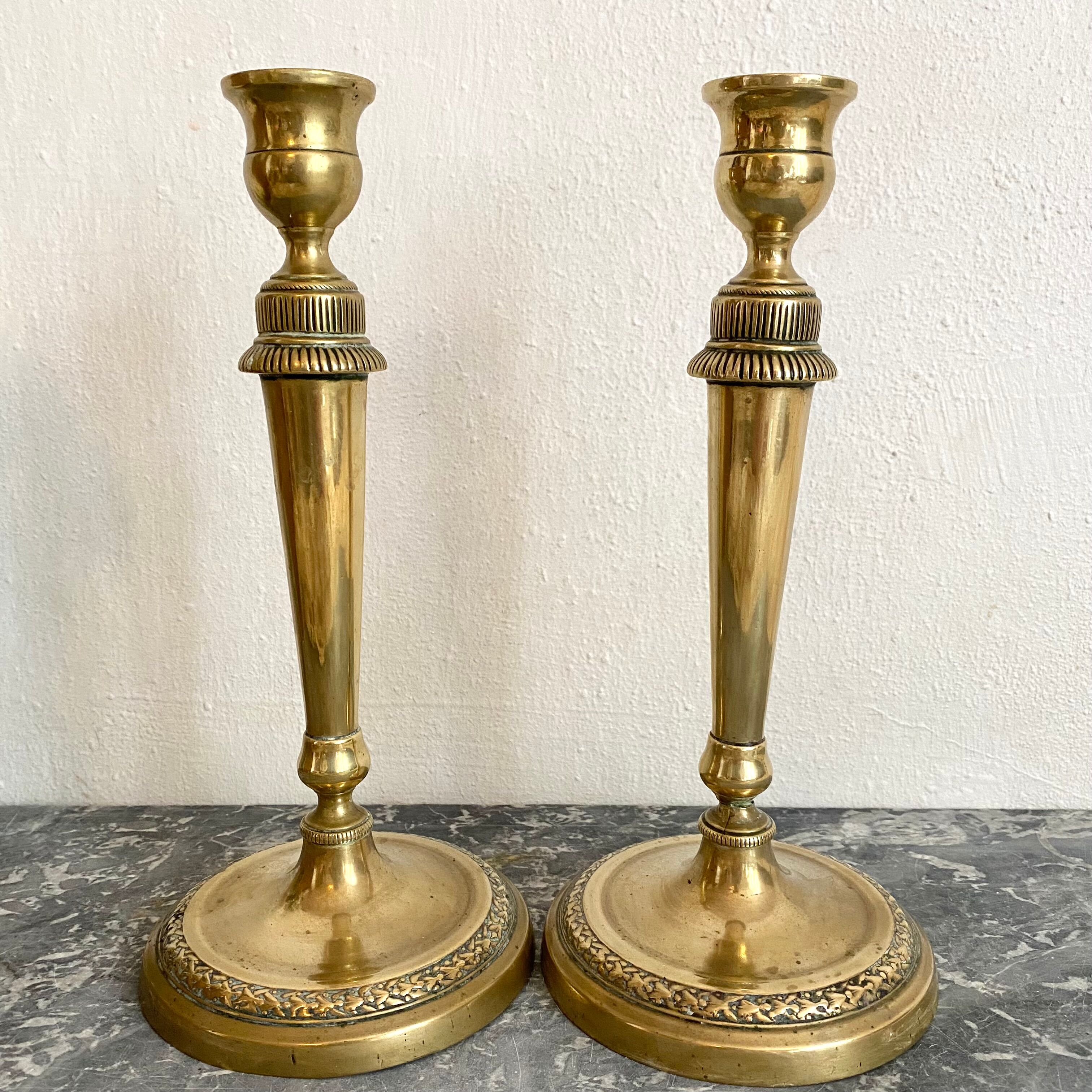 Pair of old gilded brass candlesticks
