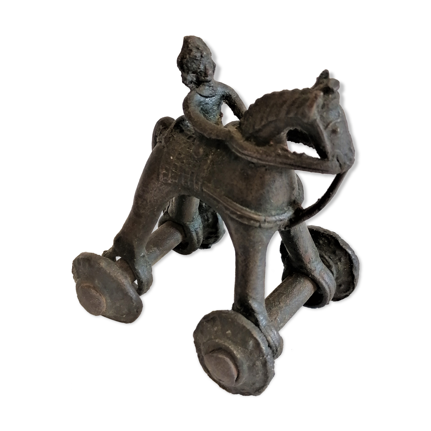 Old child's toy. Horse with bronze wheels. Ethnic object.