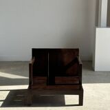 Small low armchair in varnished brown wood