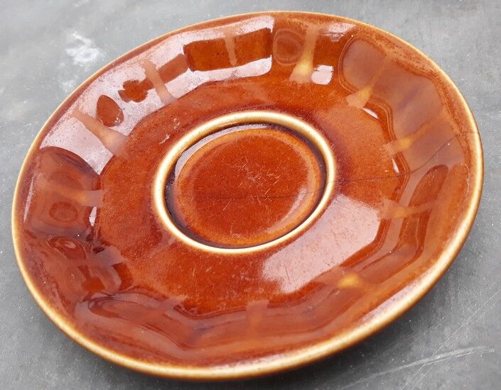 Old cups and under cups of coffee - brown ceramics typical of station buffets