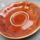 Old cups and under cups of coffee - brown ceramics typical of station buffets