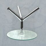 Modernist tripod side table in tempered glass and chrome metal.