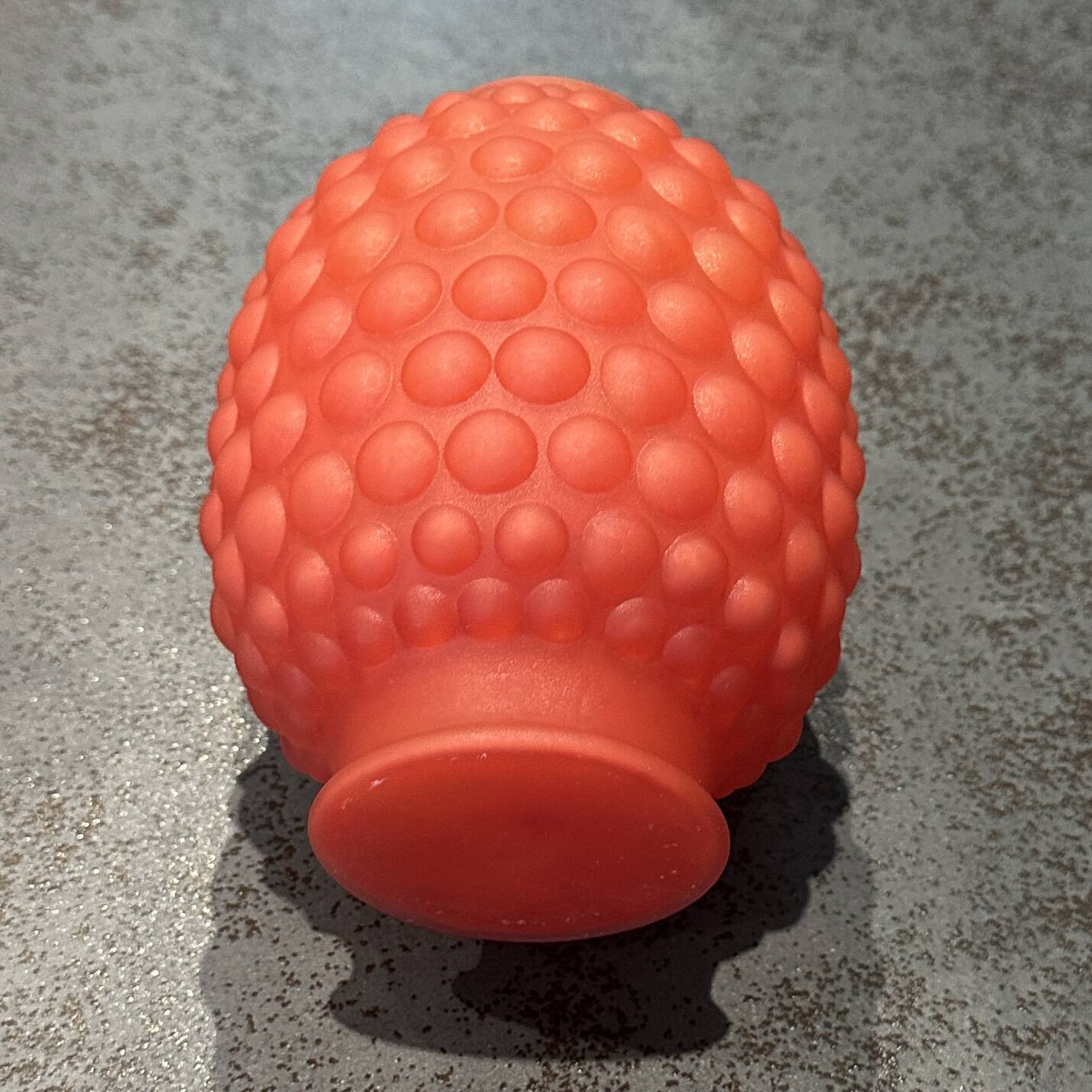 Small Art Deco ball vase in red-orange tinted glass