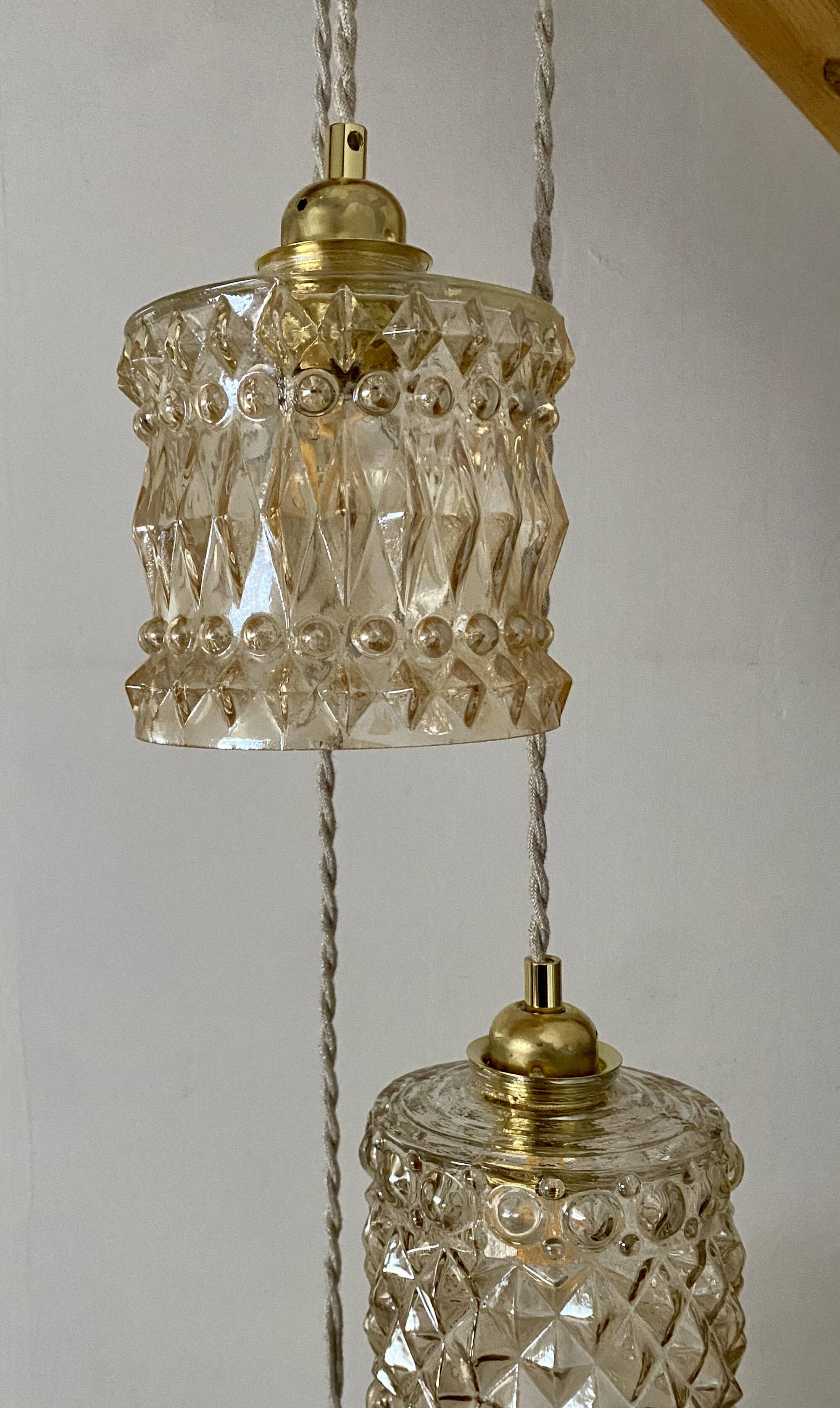 Triple antique globe pendant light in amber glass