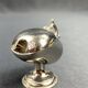Individual ashtray with metal clasp