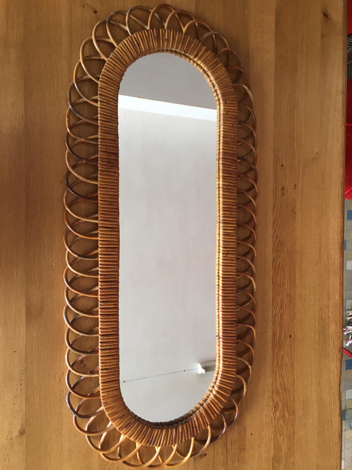 Oval mirror in vintage rattan