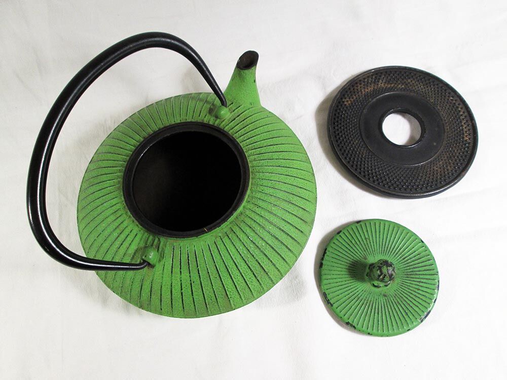Flat cast iron teapot