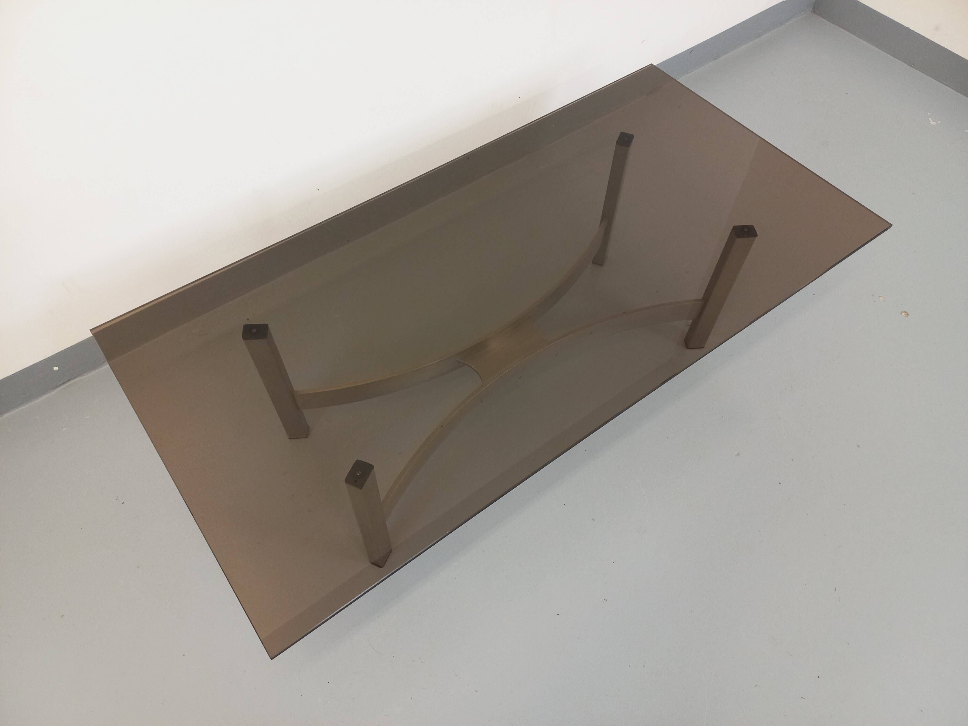 Vintage coffee table in smoked glass and brushed cast aluminum from the 70s