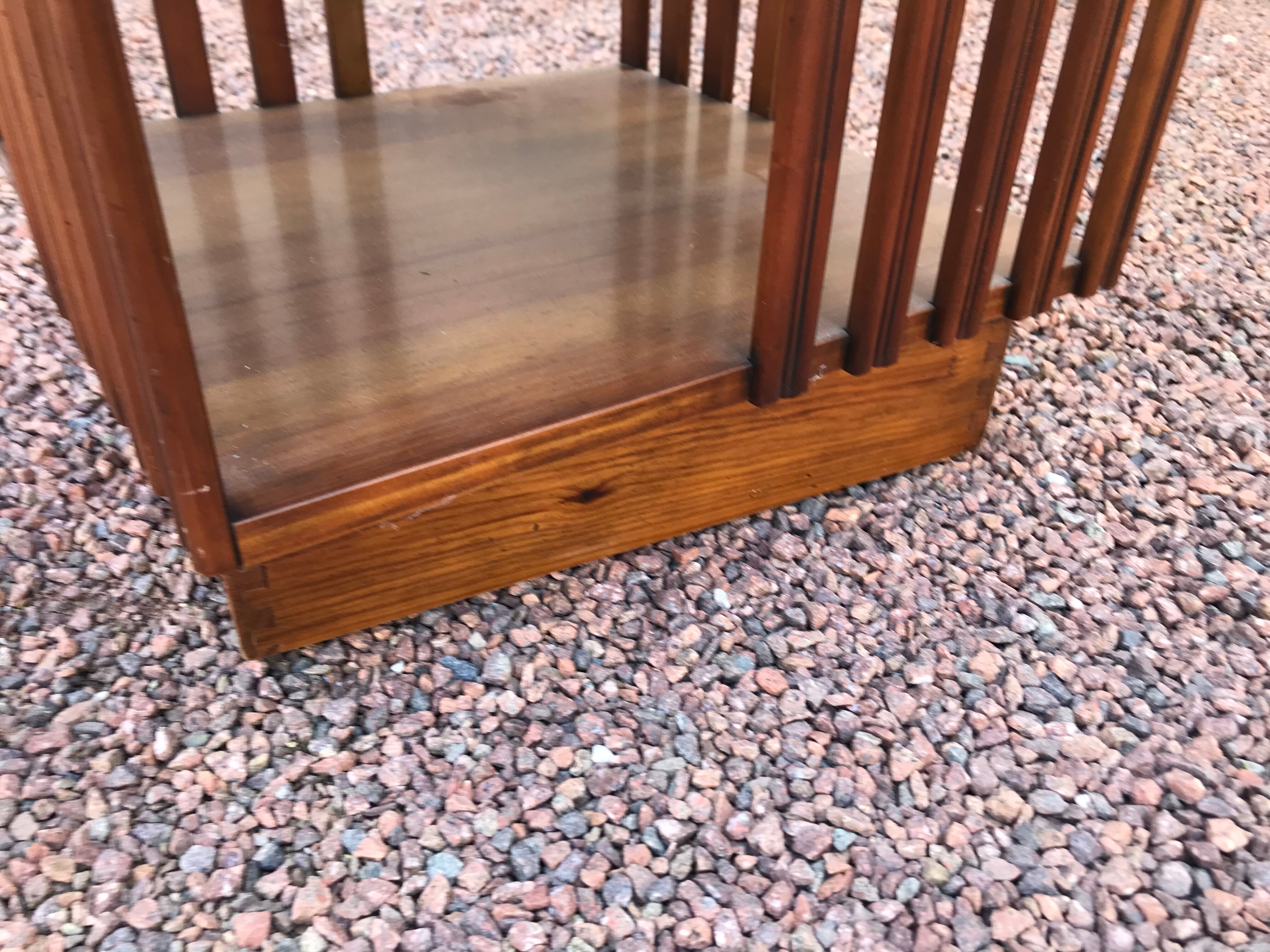 Revolving cherry bookcase