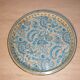 Blue cashmere round tray on white background.