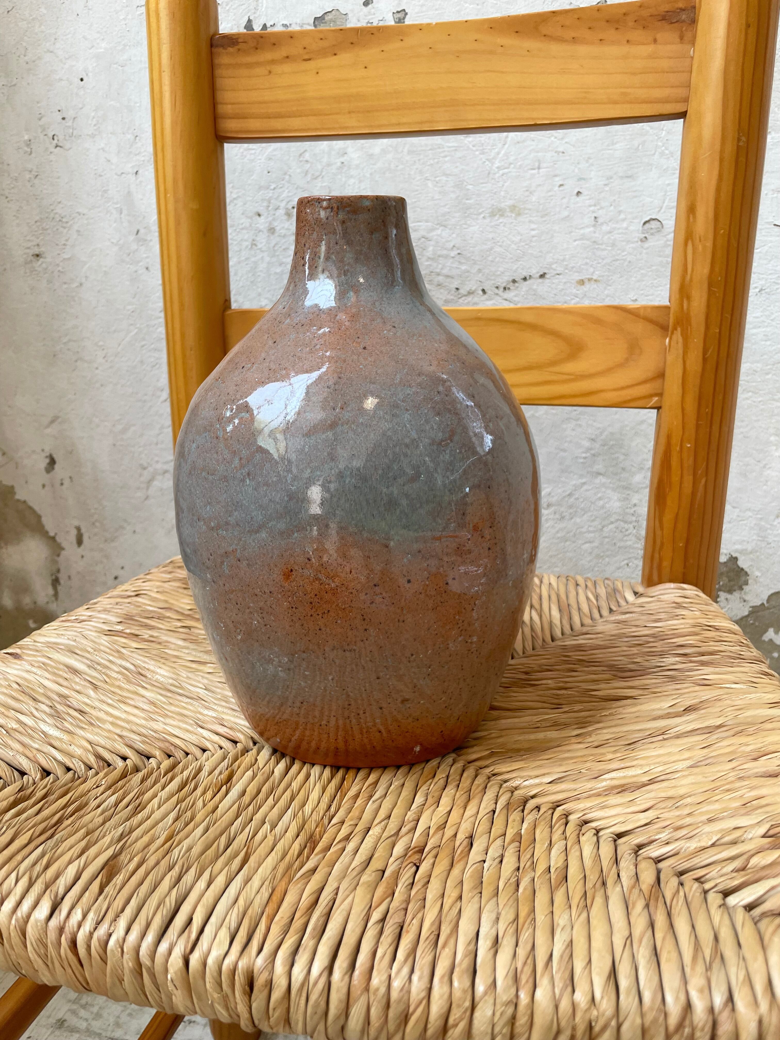 Glazed earth vase signed