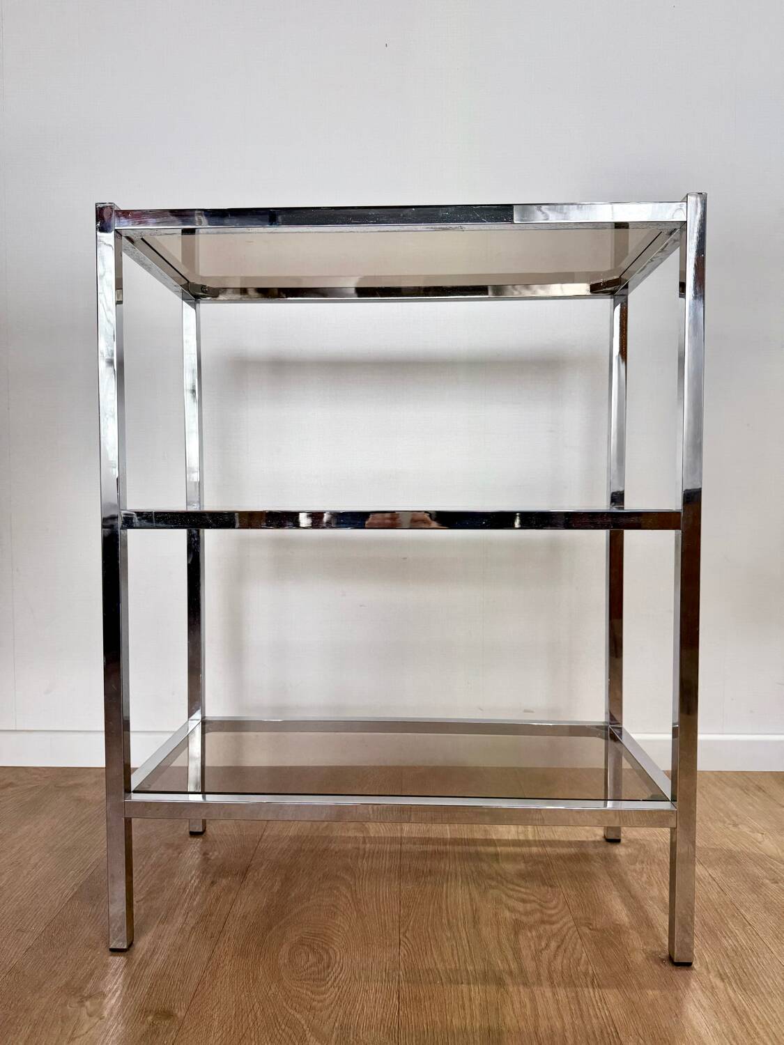Stainless steel shelf and smoked glass
