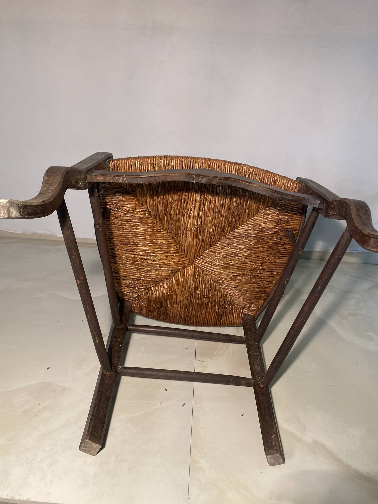 Antique Provencal armchair in carved wood with straw seat