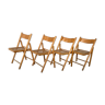 Lot de 4 chaises pliantes, design vintage,  structure en bois et  assise cannée. Vers 1970