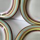 4 large graphic plates with multicoloured stripes – 26 cm