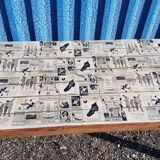 Teak dining table with illustrated top