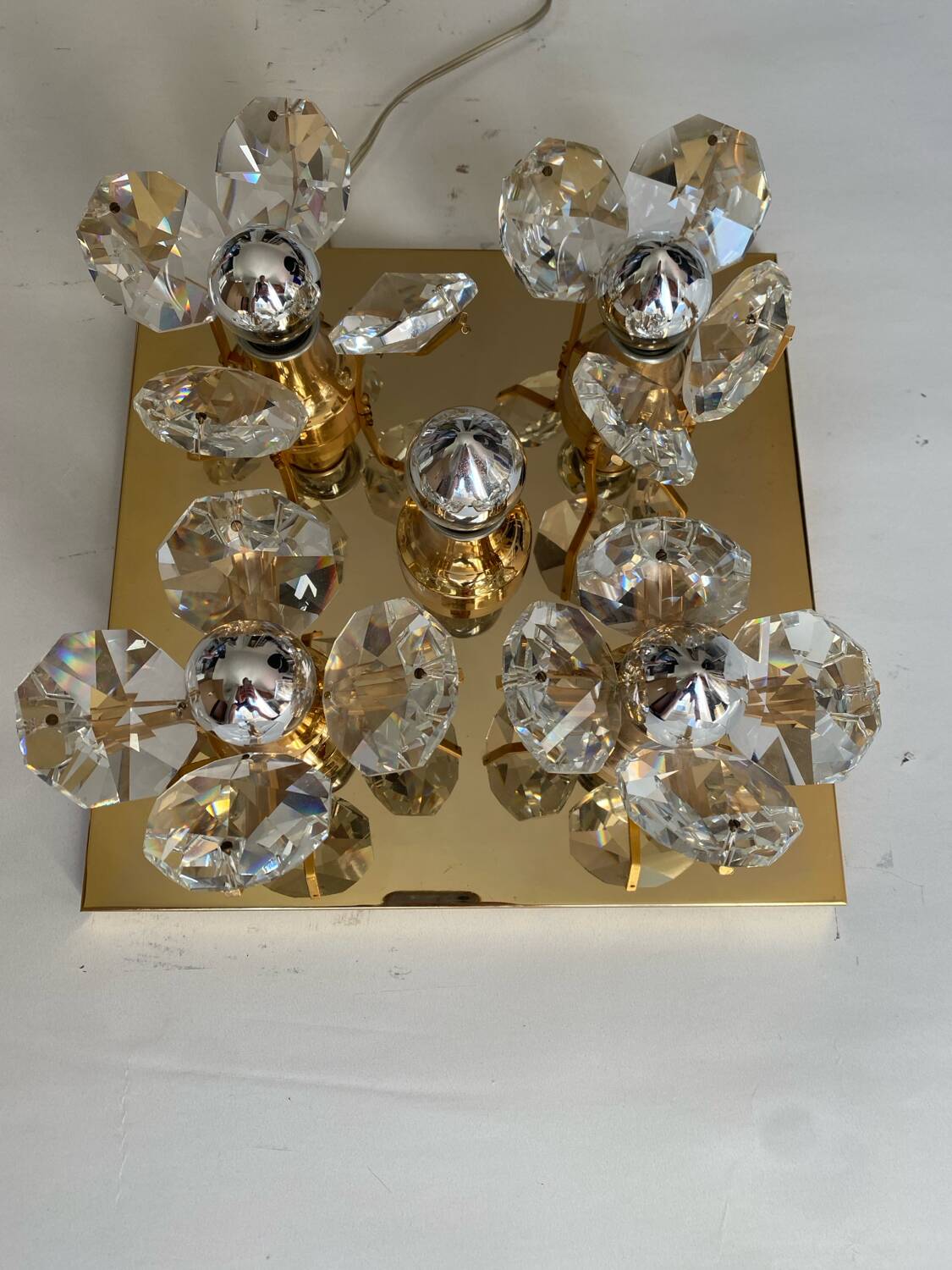 Brass wall lamp with glass prisms