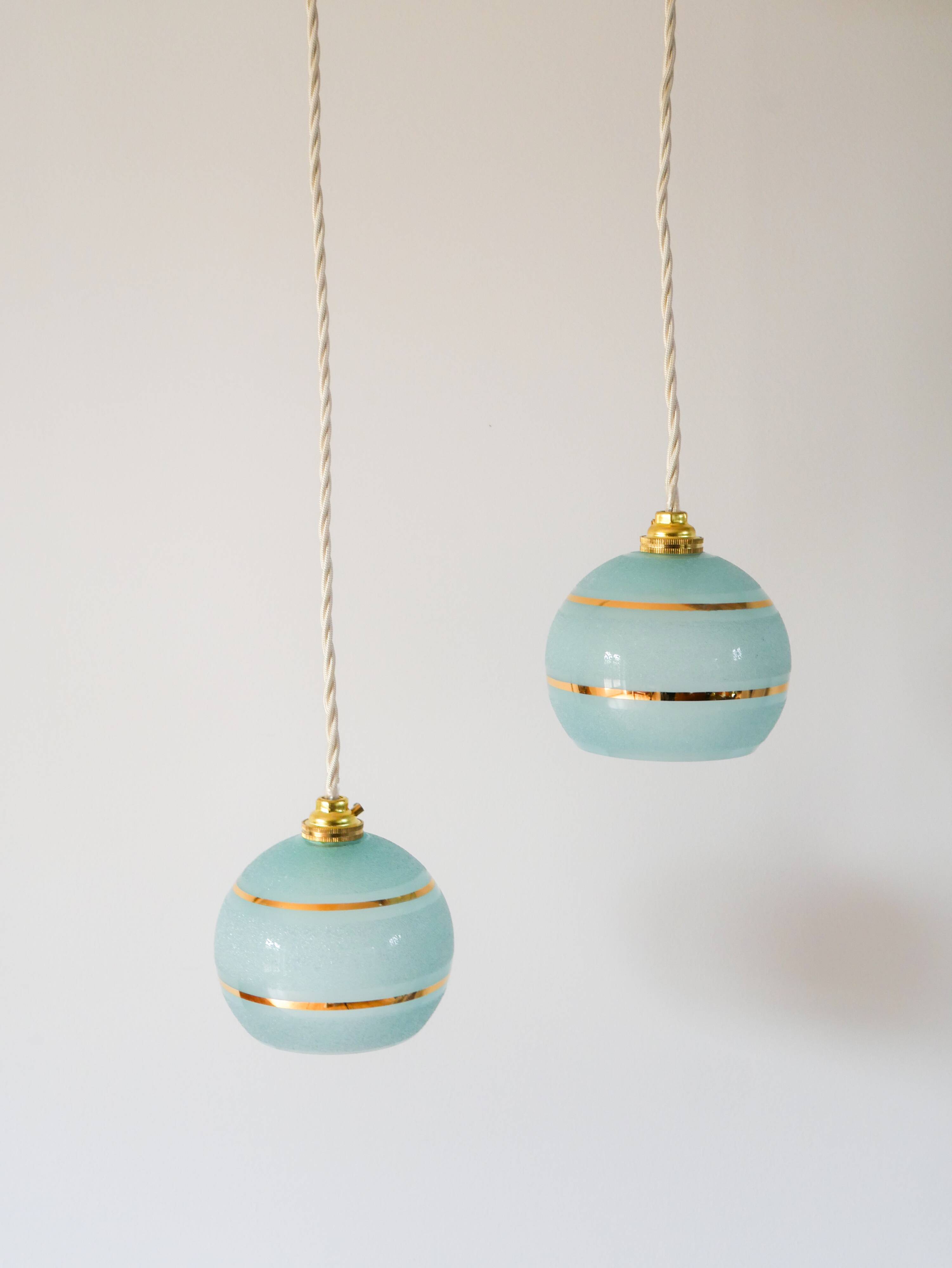 pair of blue and gold granite ball pendants 1950
