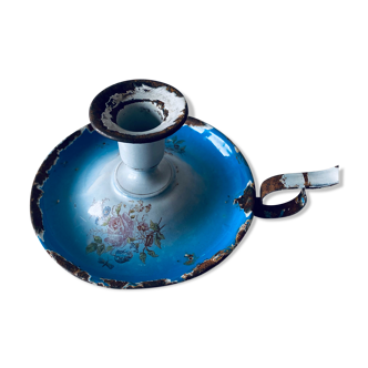 Old enamelled metal candlestick