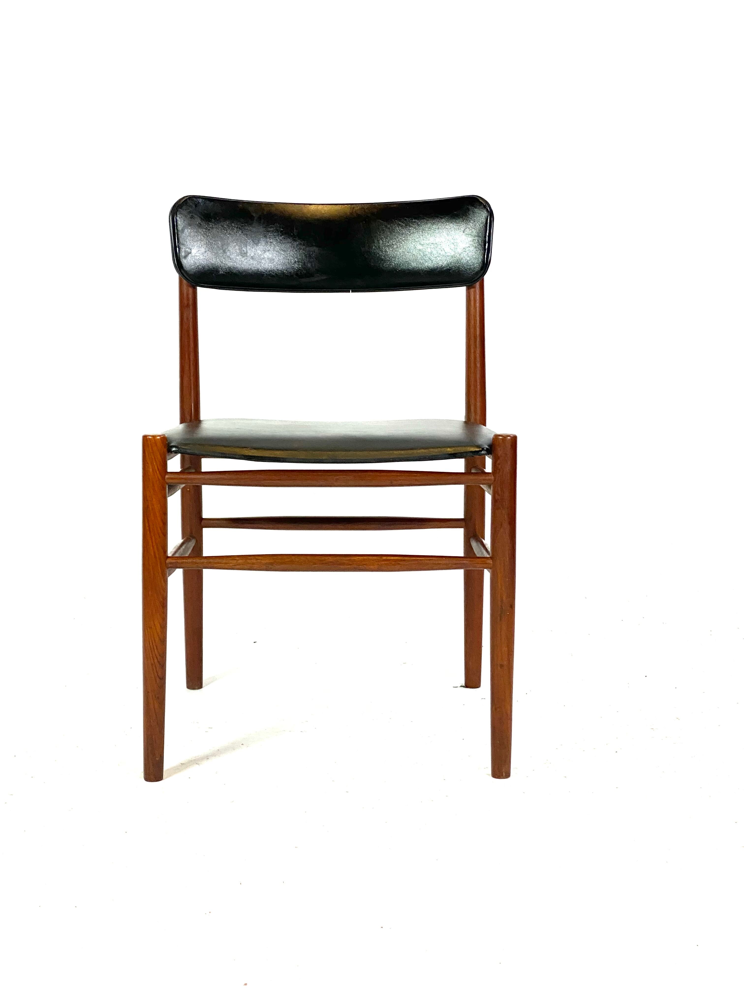 Two dining room chairs in teak and upholstered with black leather of Danish design, 1960s