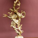 Table lamp with a tall base.