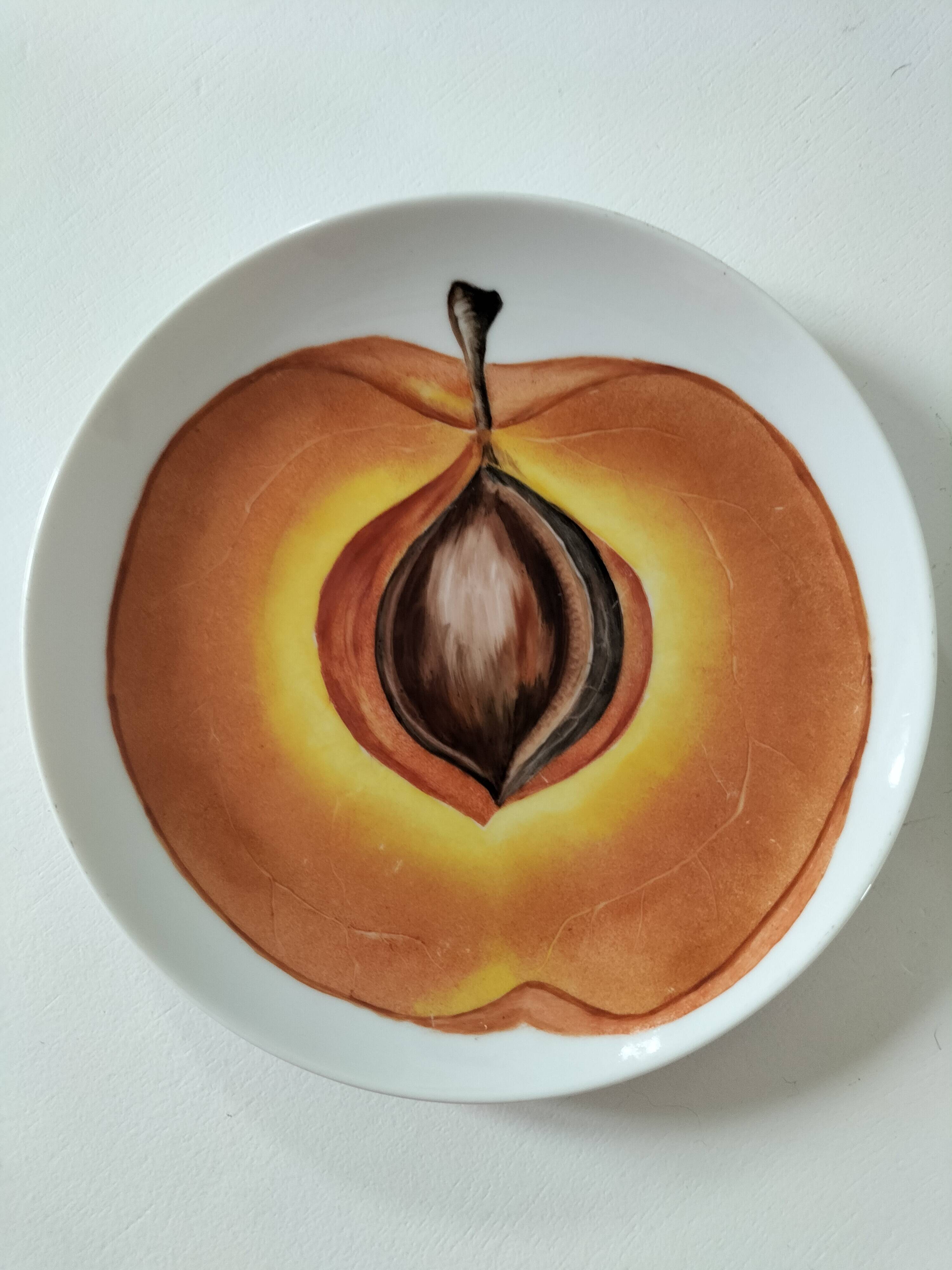 5 hand-painted dessert plates with stylised fruit designs.