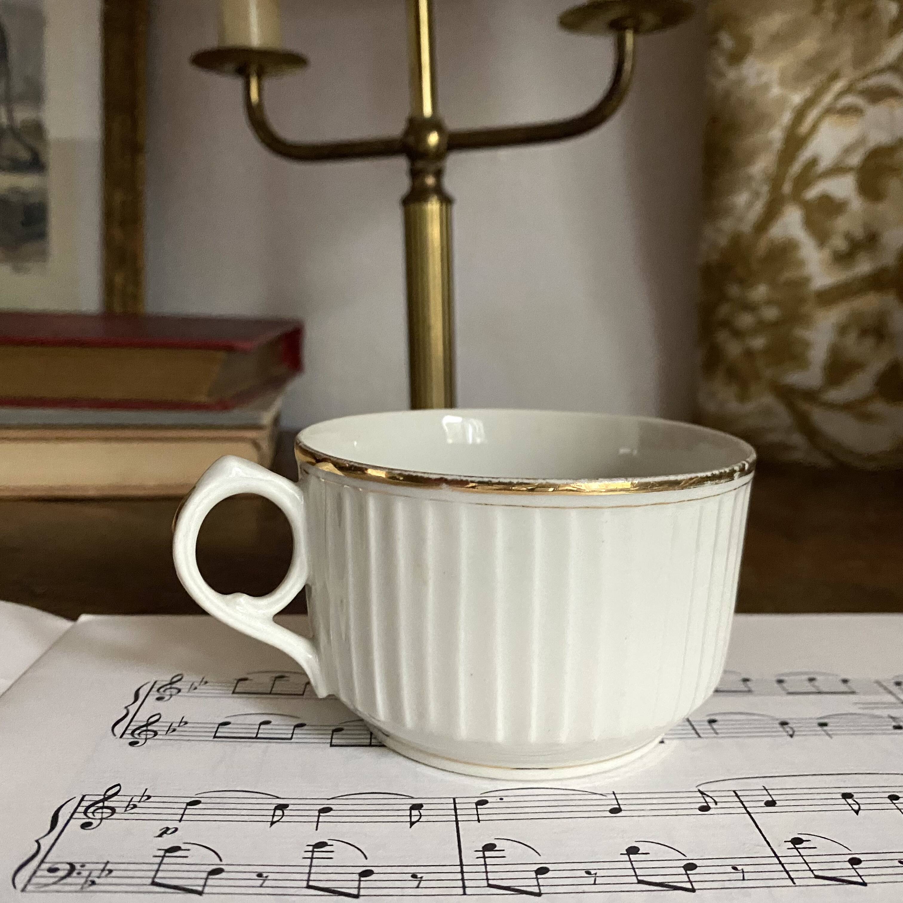 White and gold porcelain cups