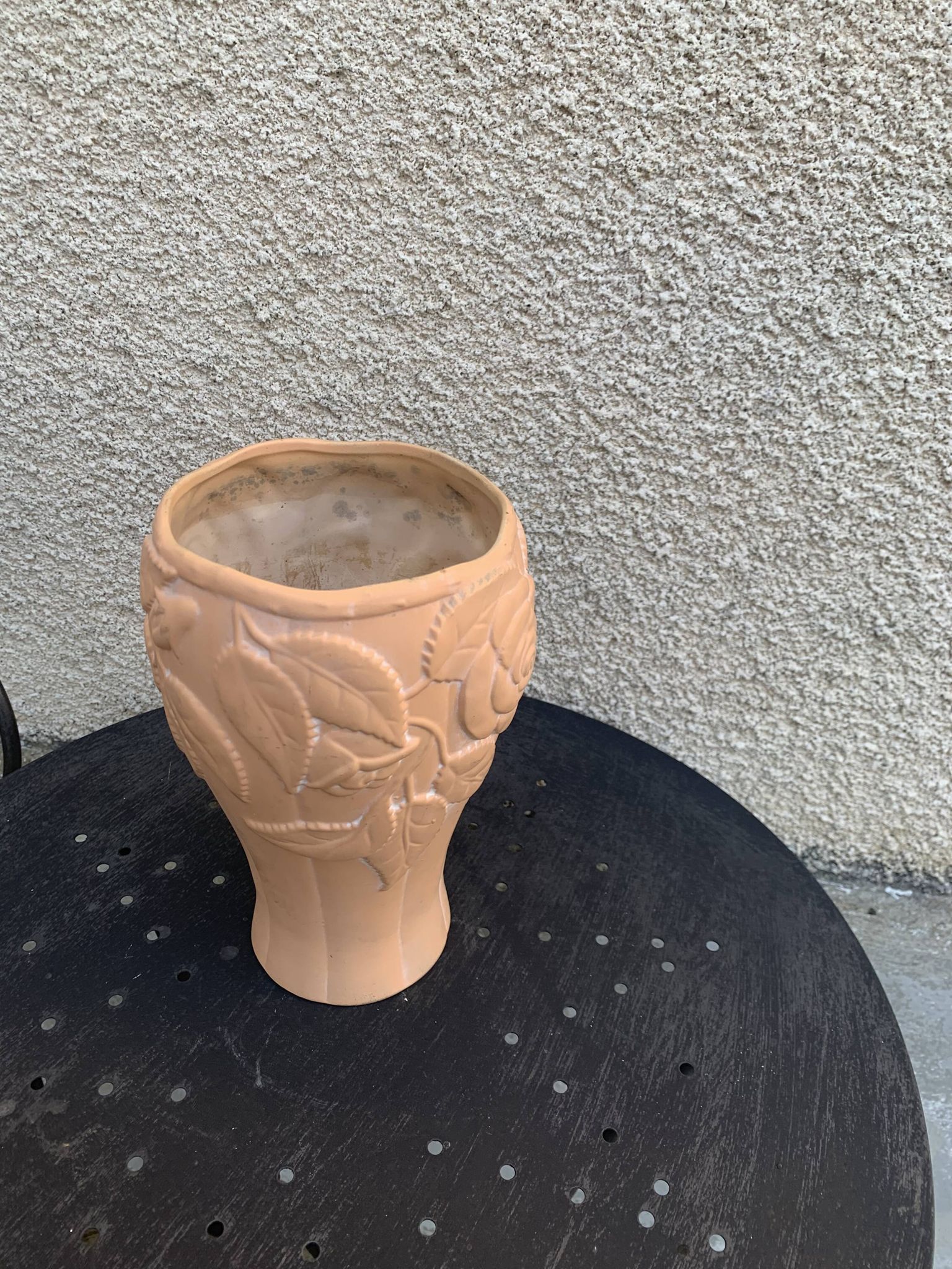 Terracotta vase with a vintage ceramic relief rose pattern
