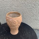 Terracotta vase with a vintage ceramic relief rose pattern