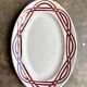 Plat ovale en terre de fer bordeaux