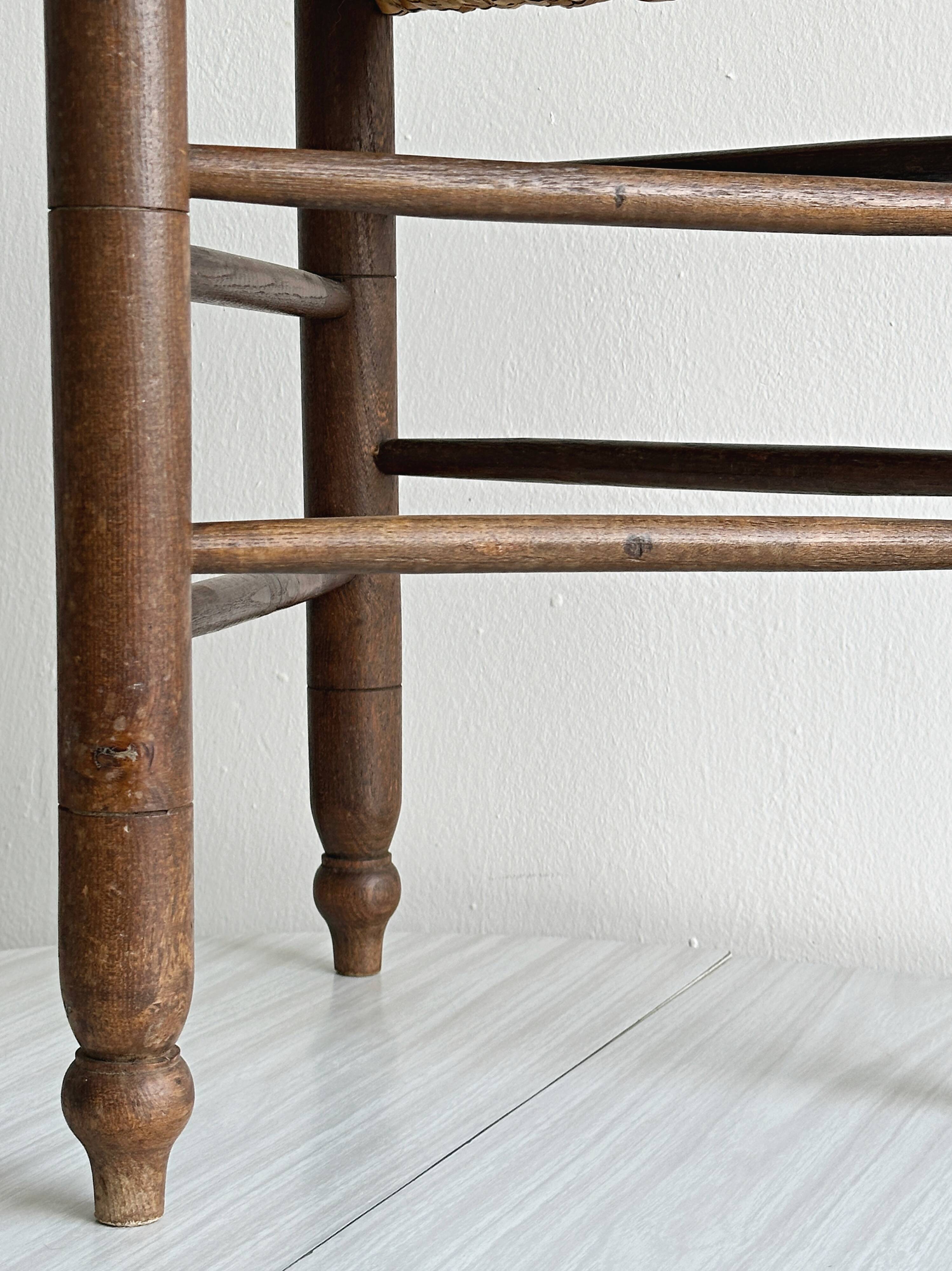 Triangular turned wooden stool