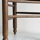 Triangular turned wooden stool