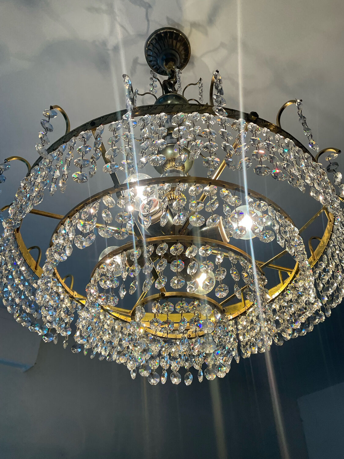 Brass chandelier with crystal pendants