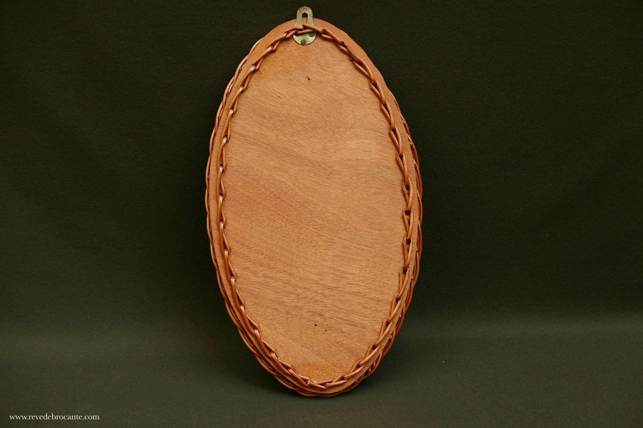 Vintage rattan oval mirror