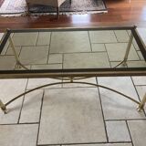 Coffee table in glass and gold metal