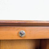 Vintage bedside table with tapered legs.