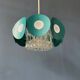 Suspension Space Age with glass shade and green/blue metal structure.