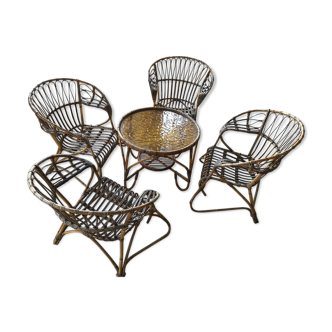 Four armchairs and a rattan table