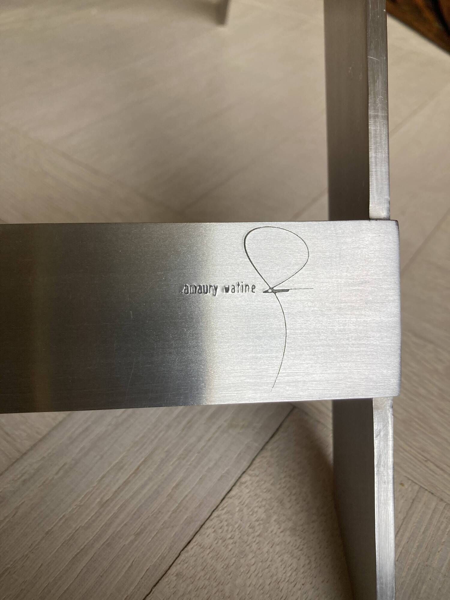 FOLDING STOOL KNOWN AS "PLOYANT" IN BRUSHED STEEL AND LEATHER, SIGNED AMAURY WATINE