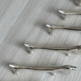 6 dog-shaped knife rests, in silver-plated metal.