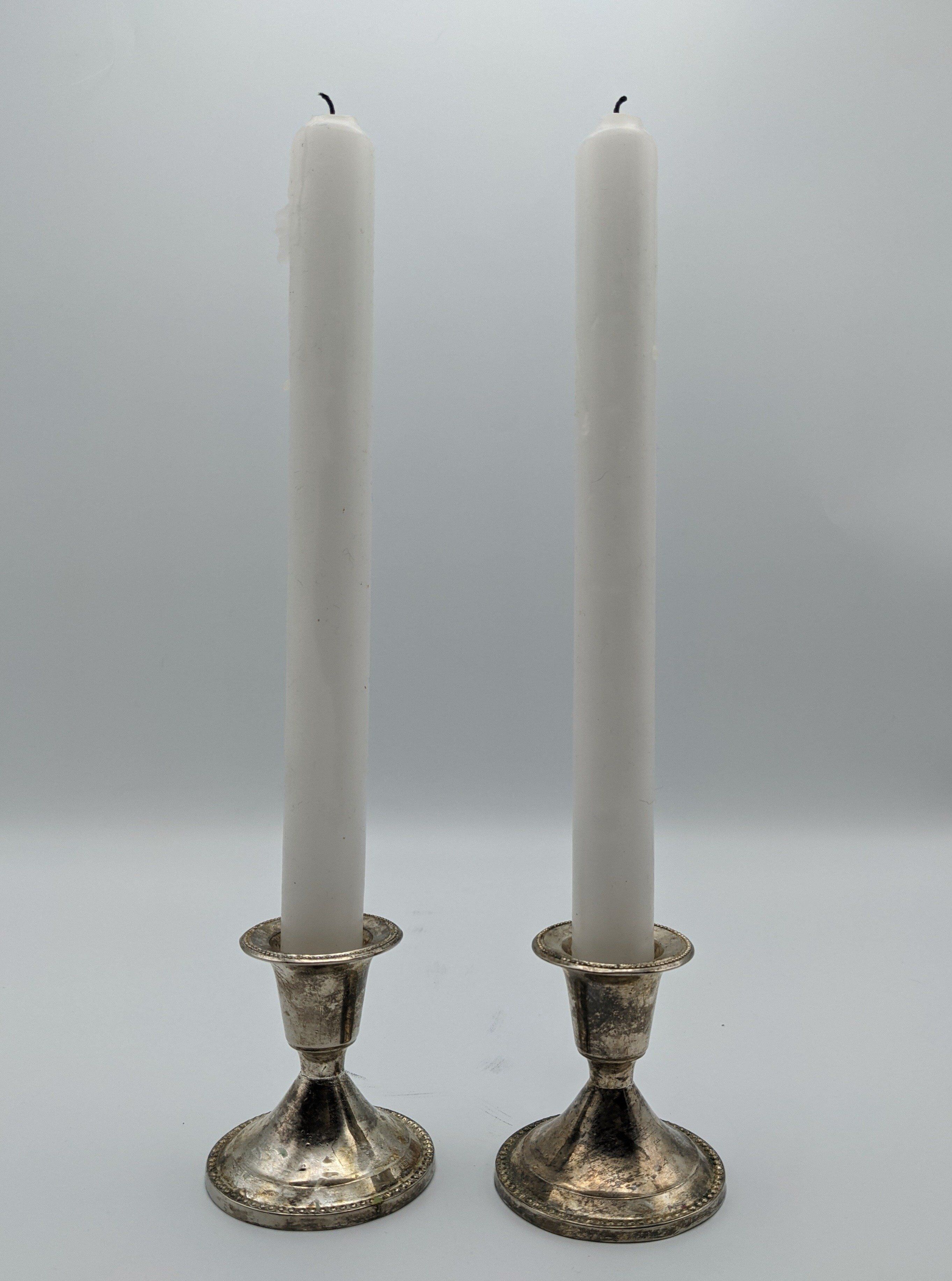 Pair of silver metal candlesticks