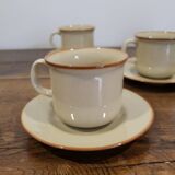 5 enameled stoneware cups and saucers