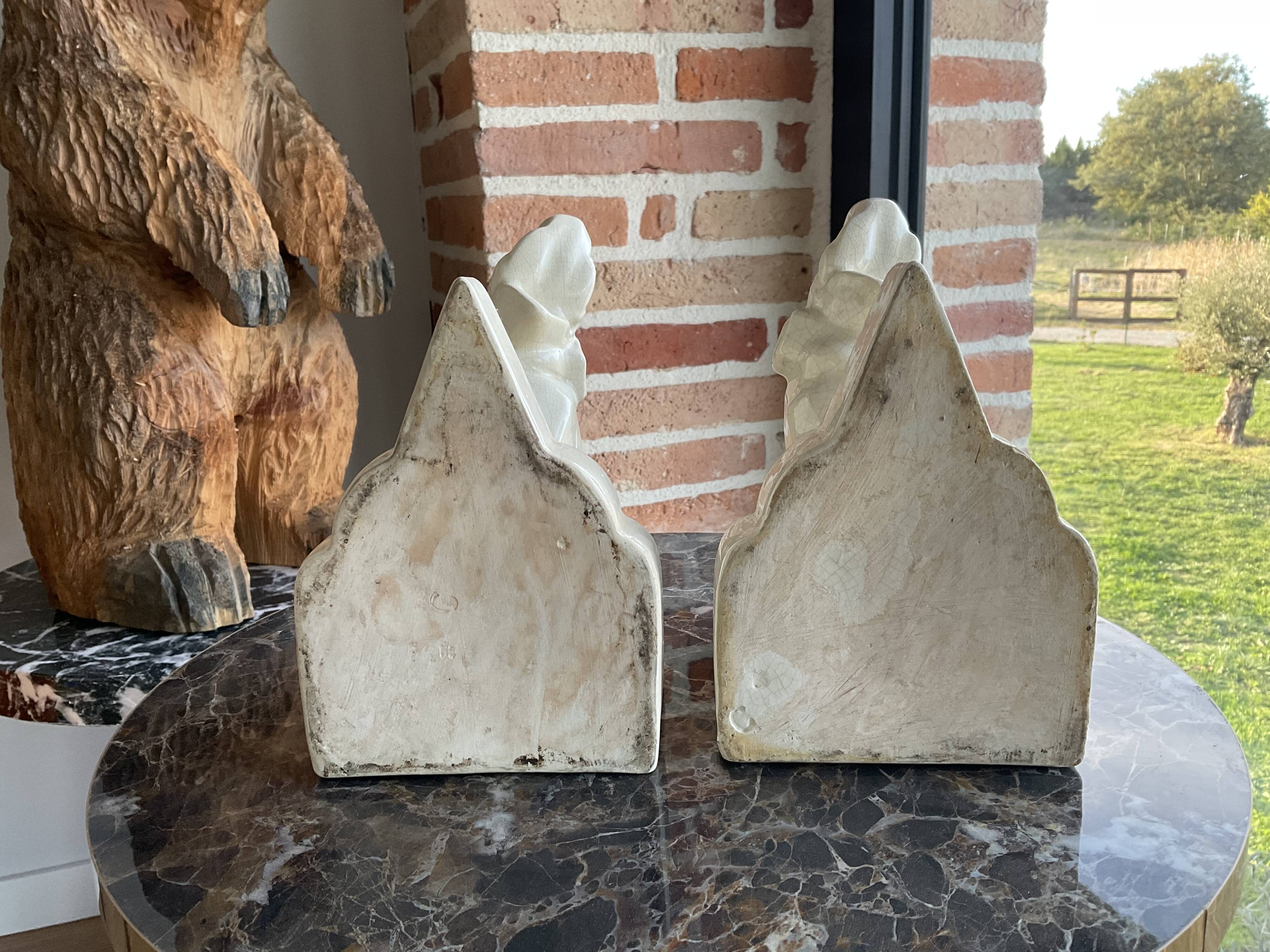 Pair of cracked earthenware bookends. ART DECO