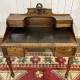 Louis XVI style desk from the late 19th century in walnut with a leather top.